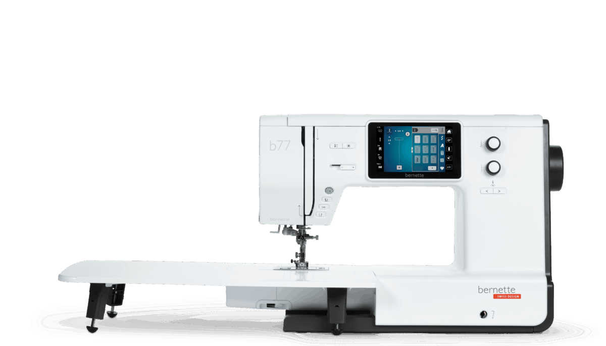 Official manufacturer image of the exact bernette 77 with its slide-on extension table attached. The manufacturer does not state whether the image is a photograph or rendering; the picture does not show every supplied accessory.