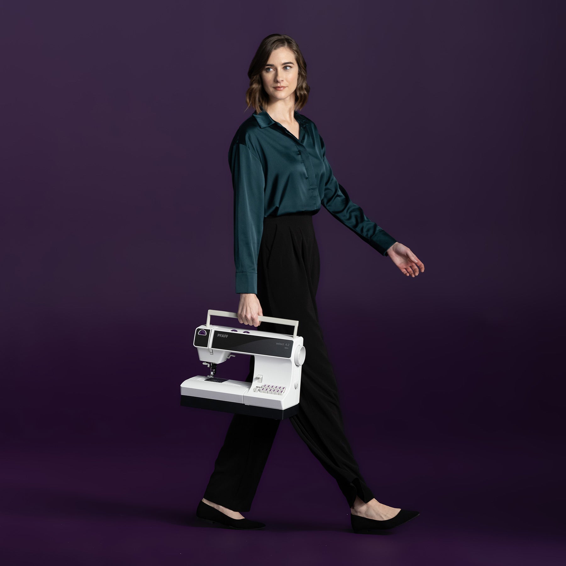 PFAFF select 4.2 sewing machine with its model mark visible in an official manufacturer lifestyle image.